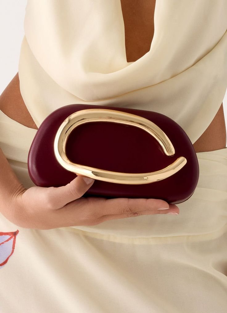 Sculptural Gold Handle Clutch Purse